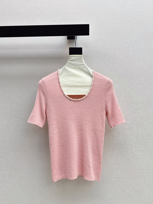 Pearl embellishments on a short-sleeved top