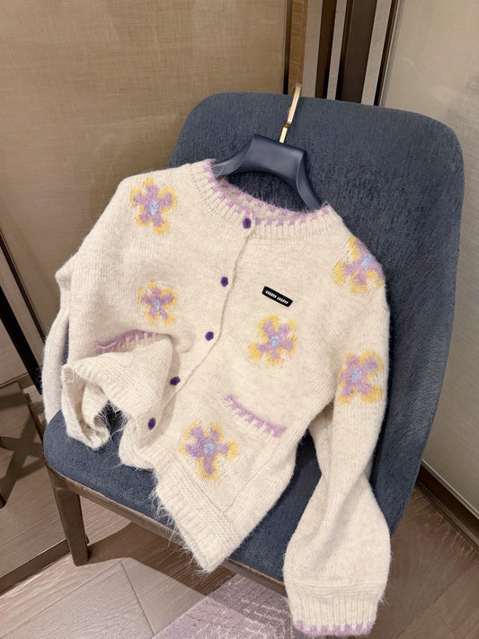 26Mohair-style knit cardigan—a piece that exudes an air of luxury.
