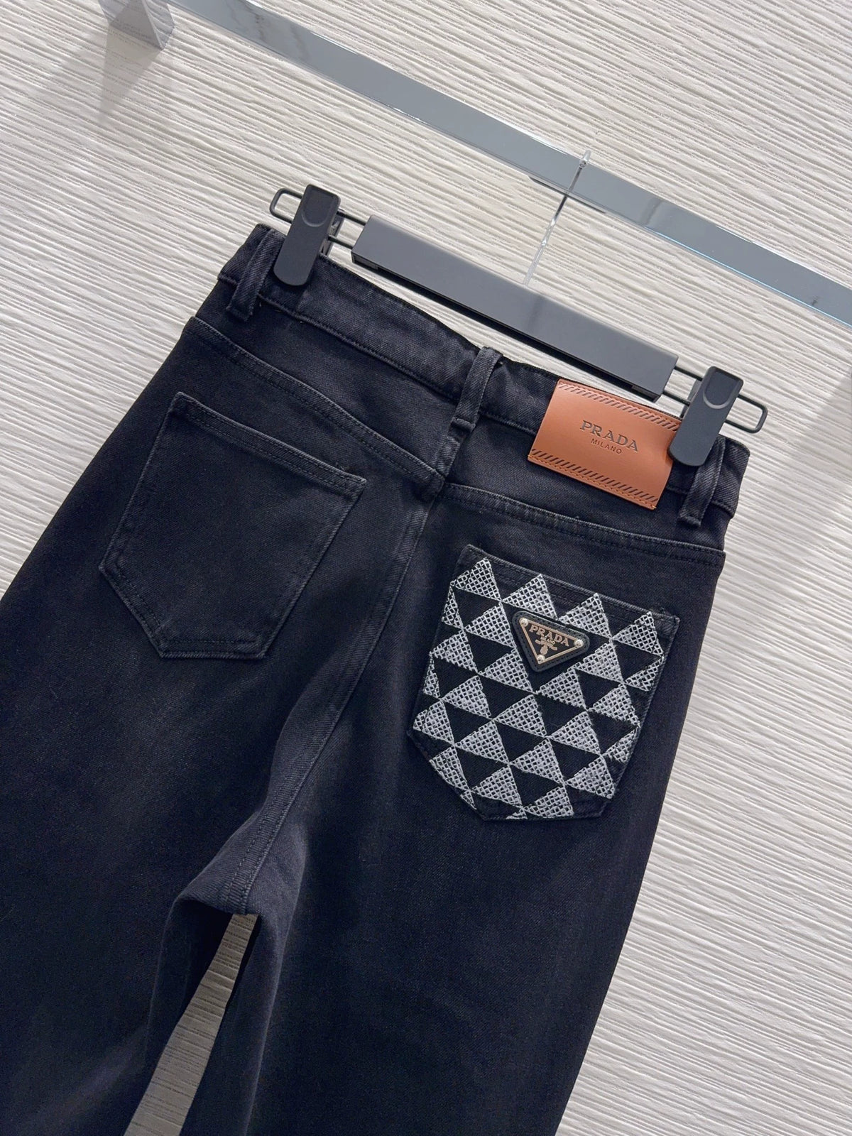 26New-Arrival Jeans with Rear Triangle Logo and Pockets