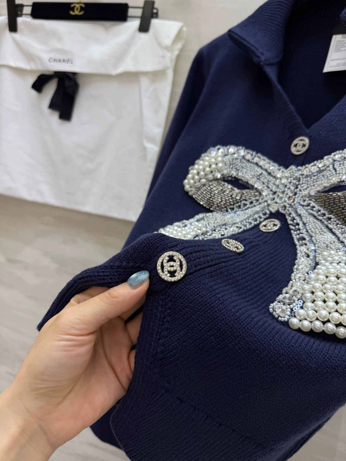 Pearl-studded bow pullover