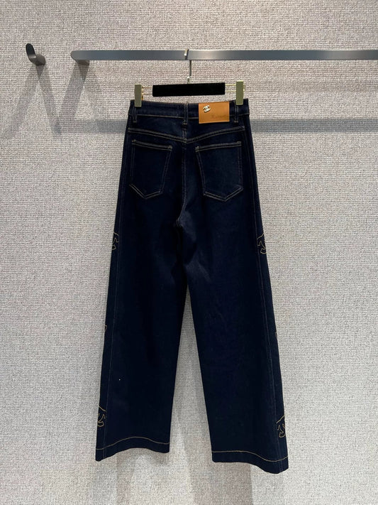 Side-embroidered washed denim jeans