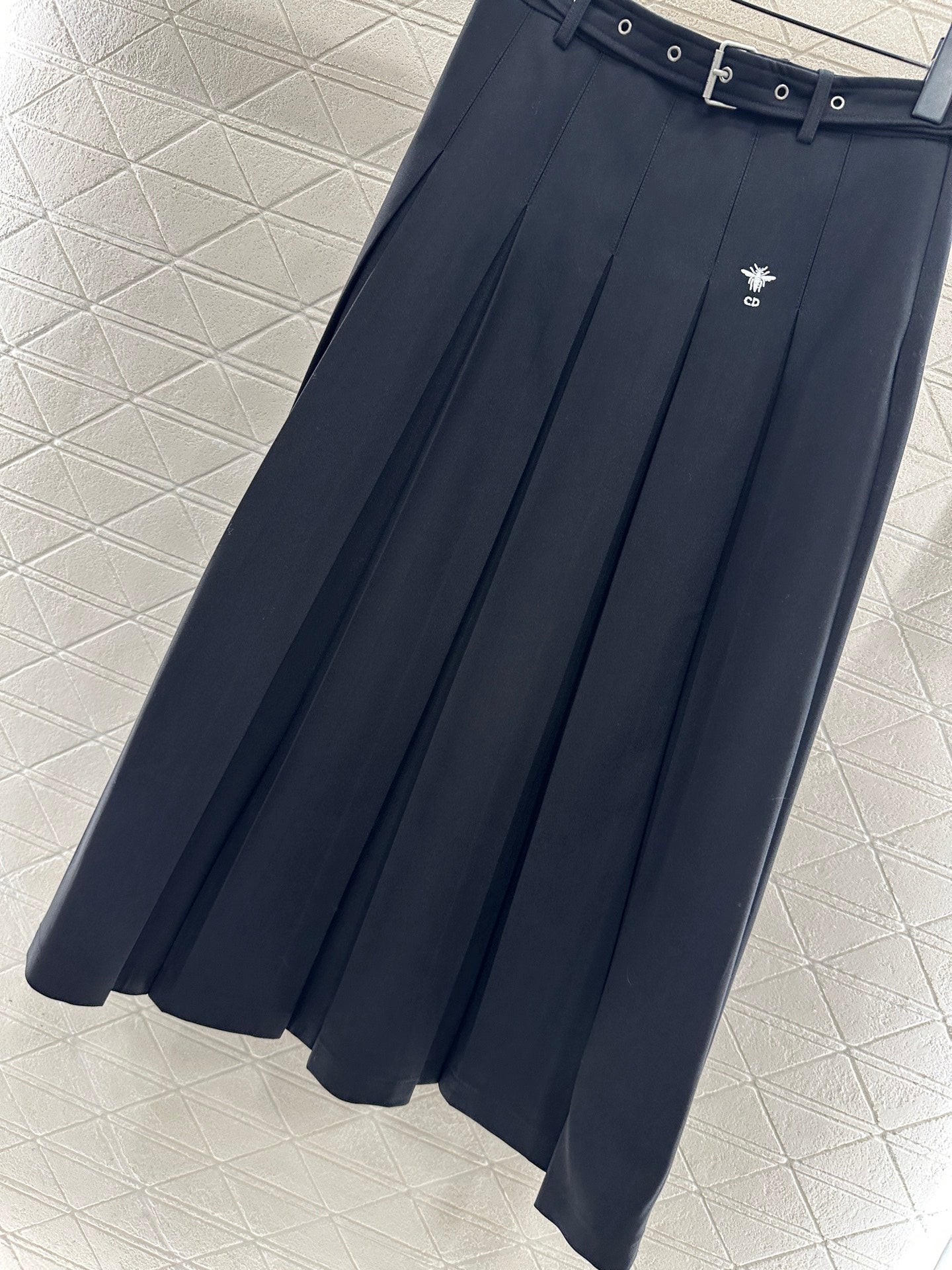 Mid length pleated skirt with waist belt