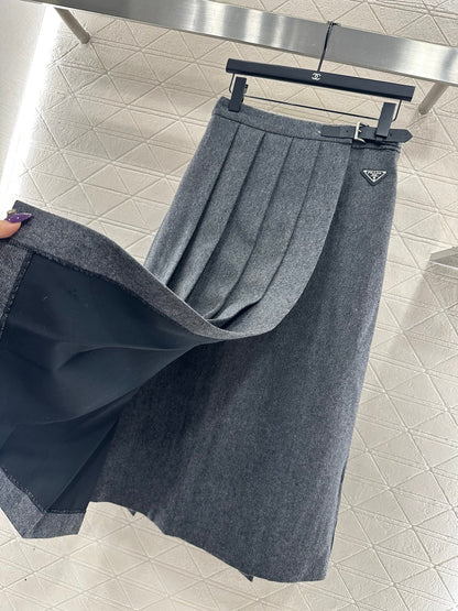 Mid length pleated skirt with waist belt