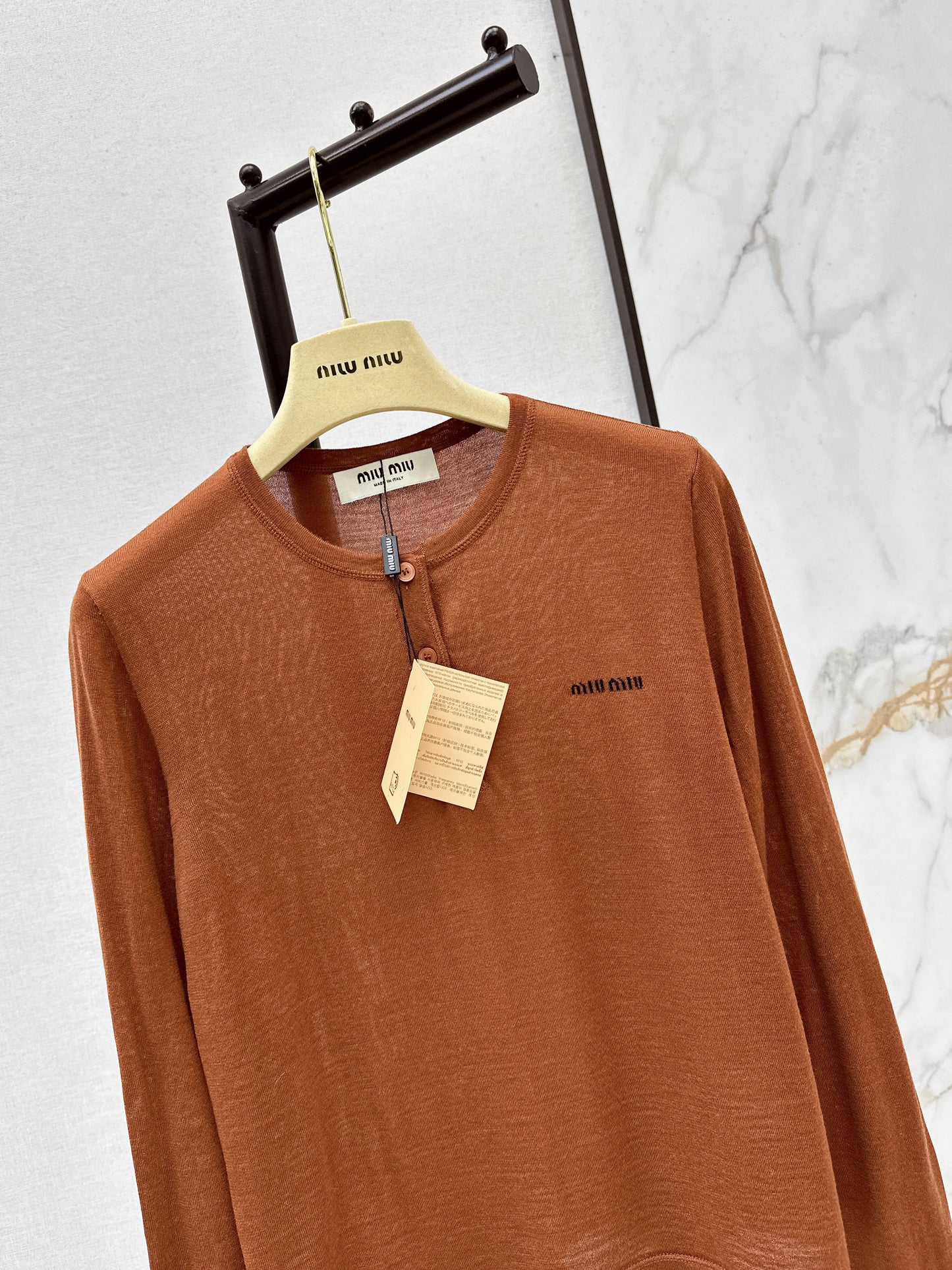 Half-open placket knit sweater