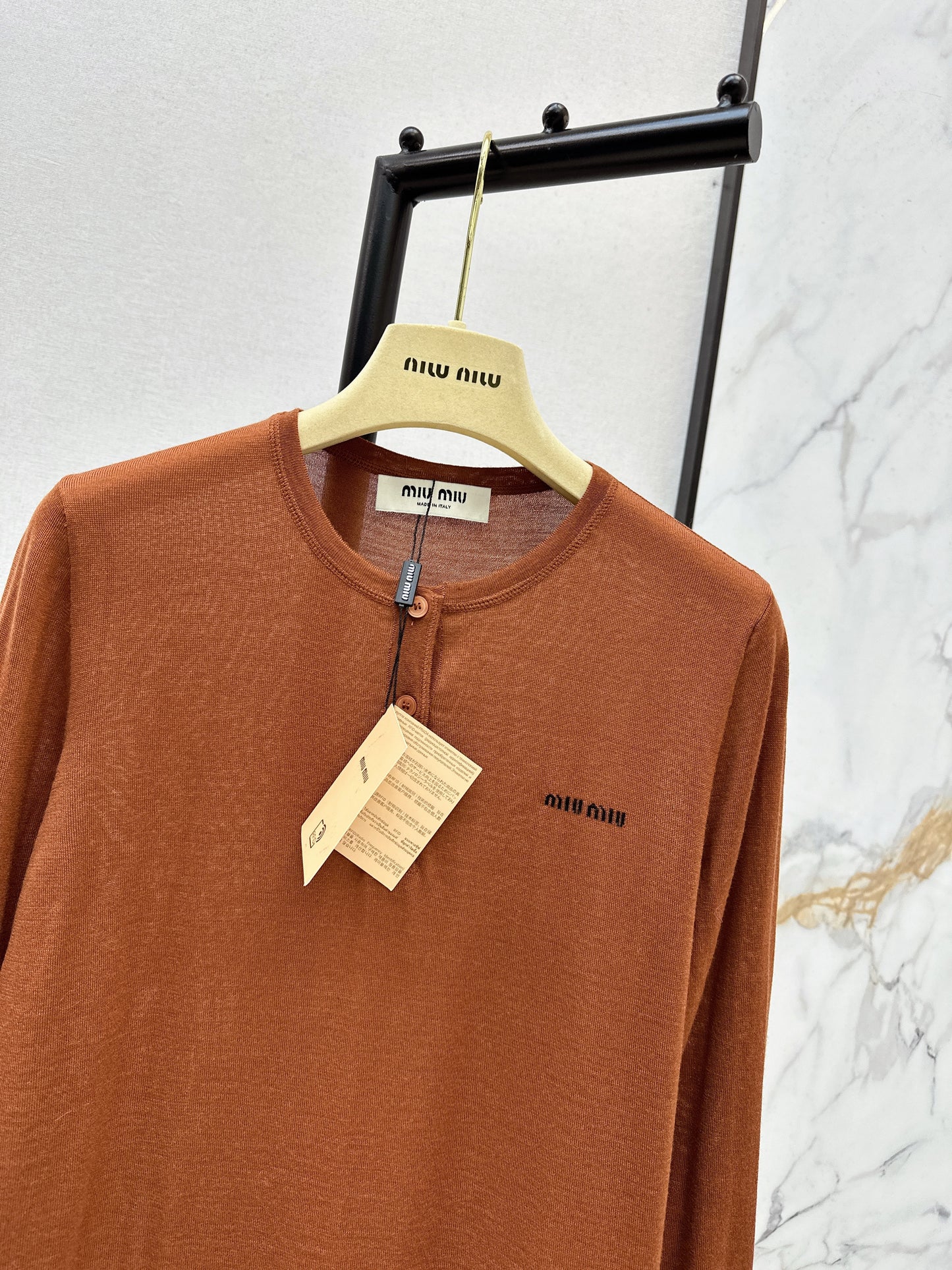 Half-open placket knit sweater