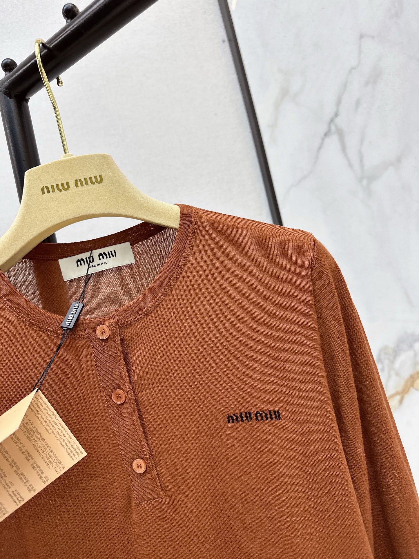 Half-open placket knit sweater