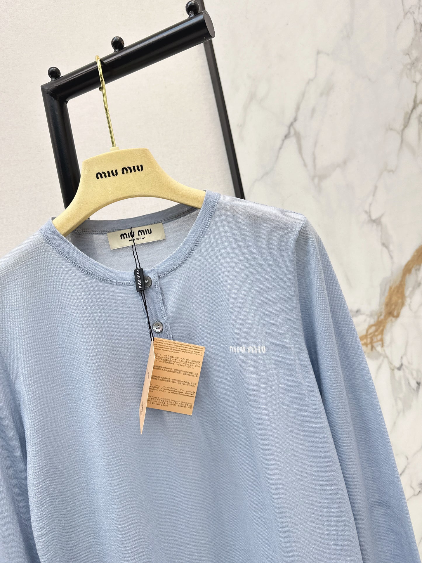 Half-open placket knit sweater
