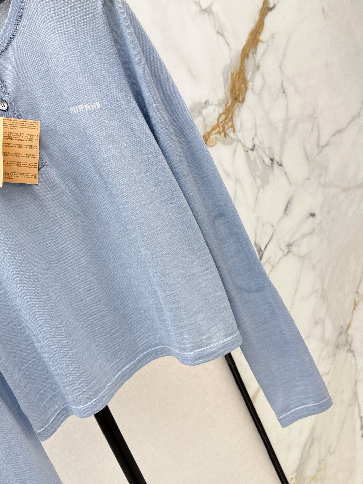 Half-open placket knit sweater