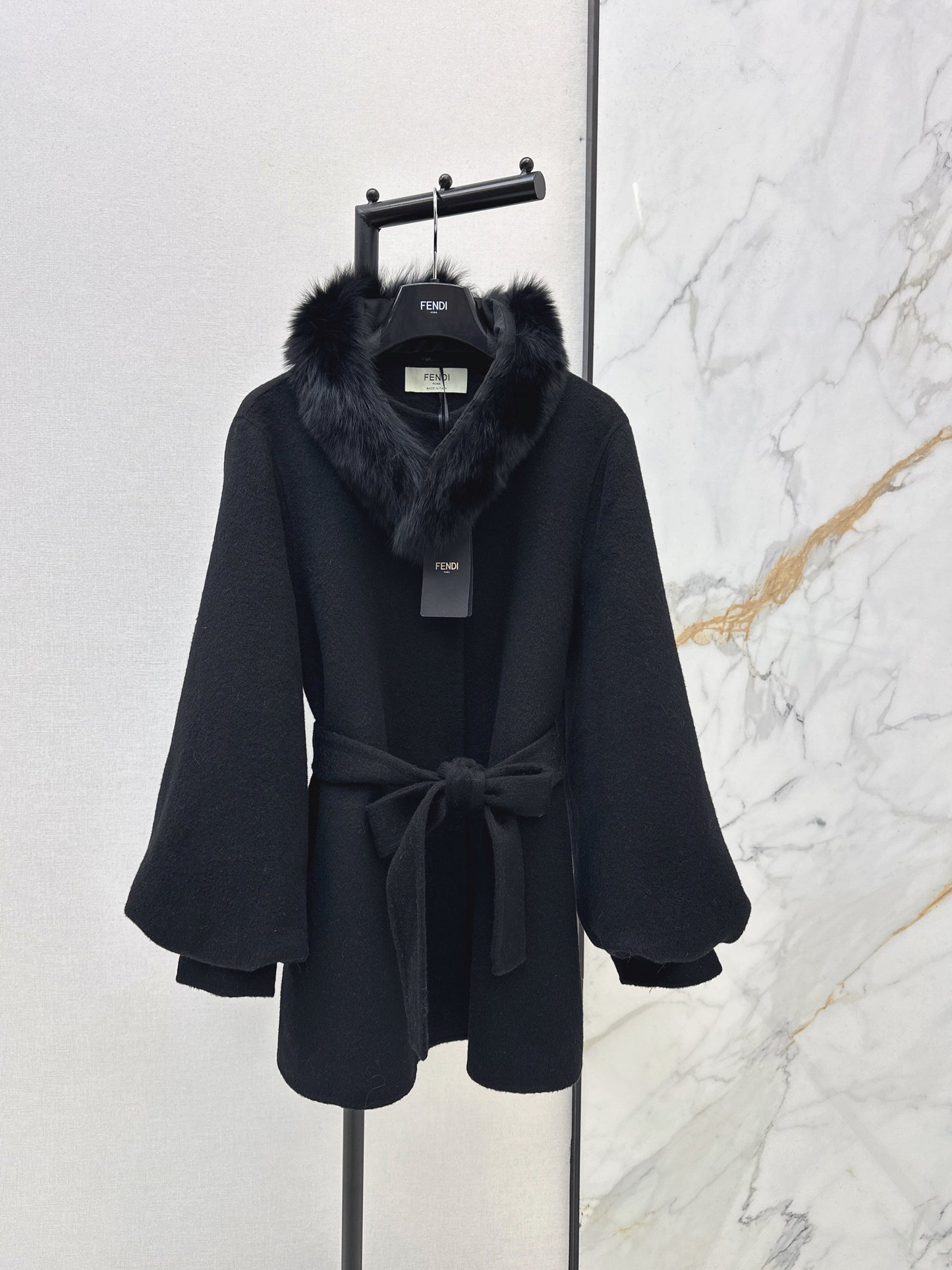 Mid-length coat with fox fur trim