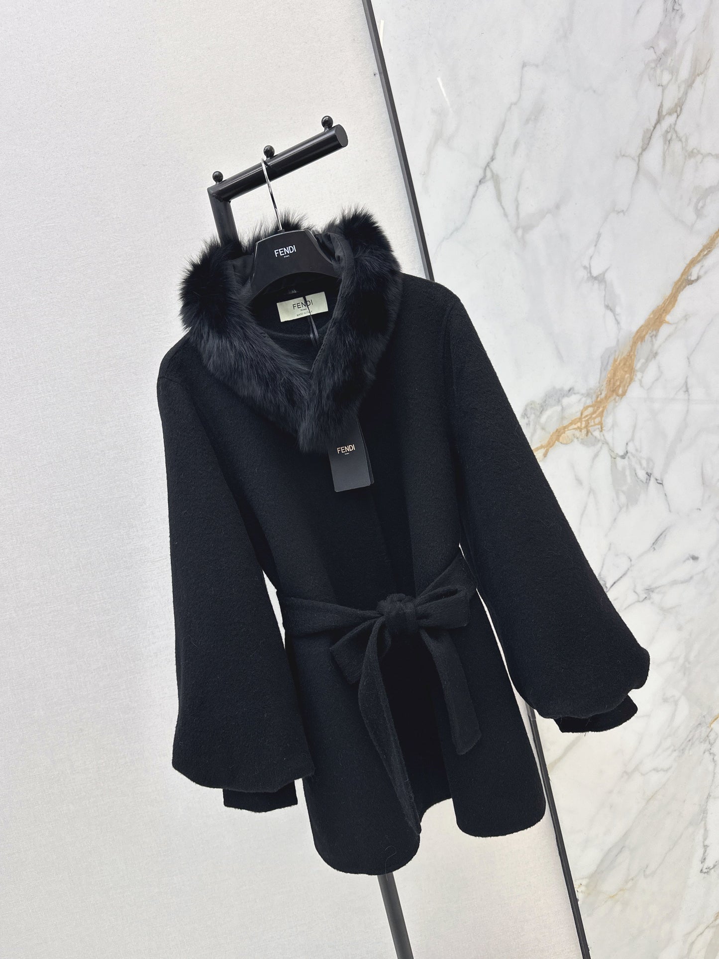 Mid-length coat with fox fur trim
