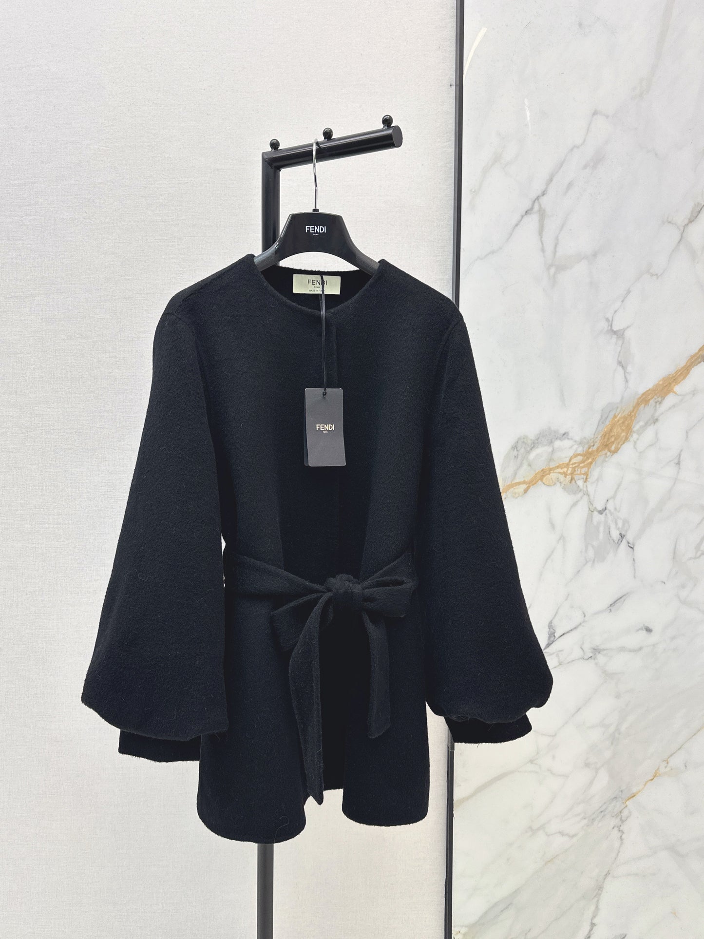 Mid-length coat with fox fur trim