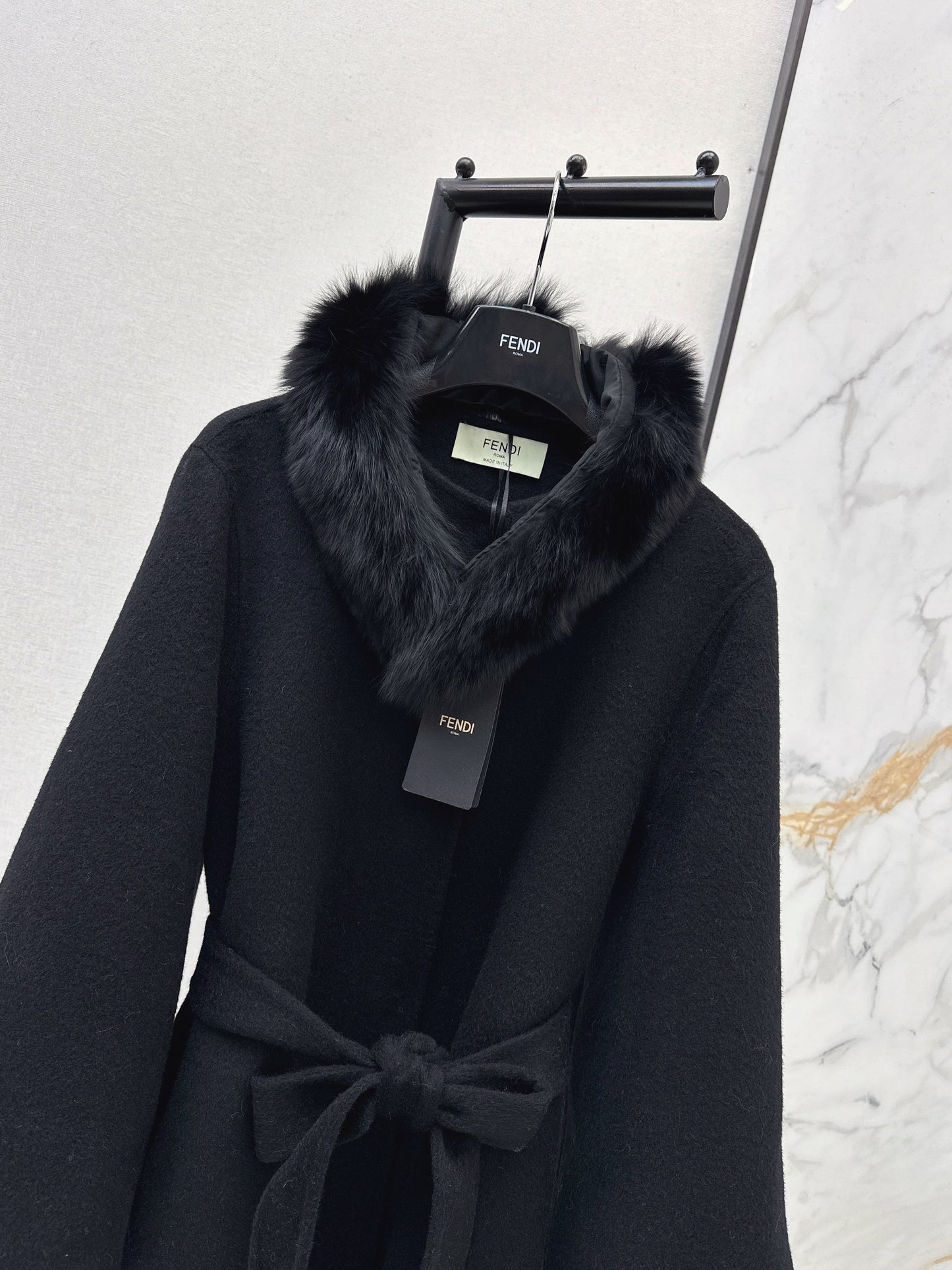 Mid-length coat with fox fur trim