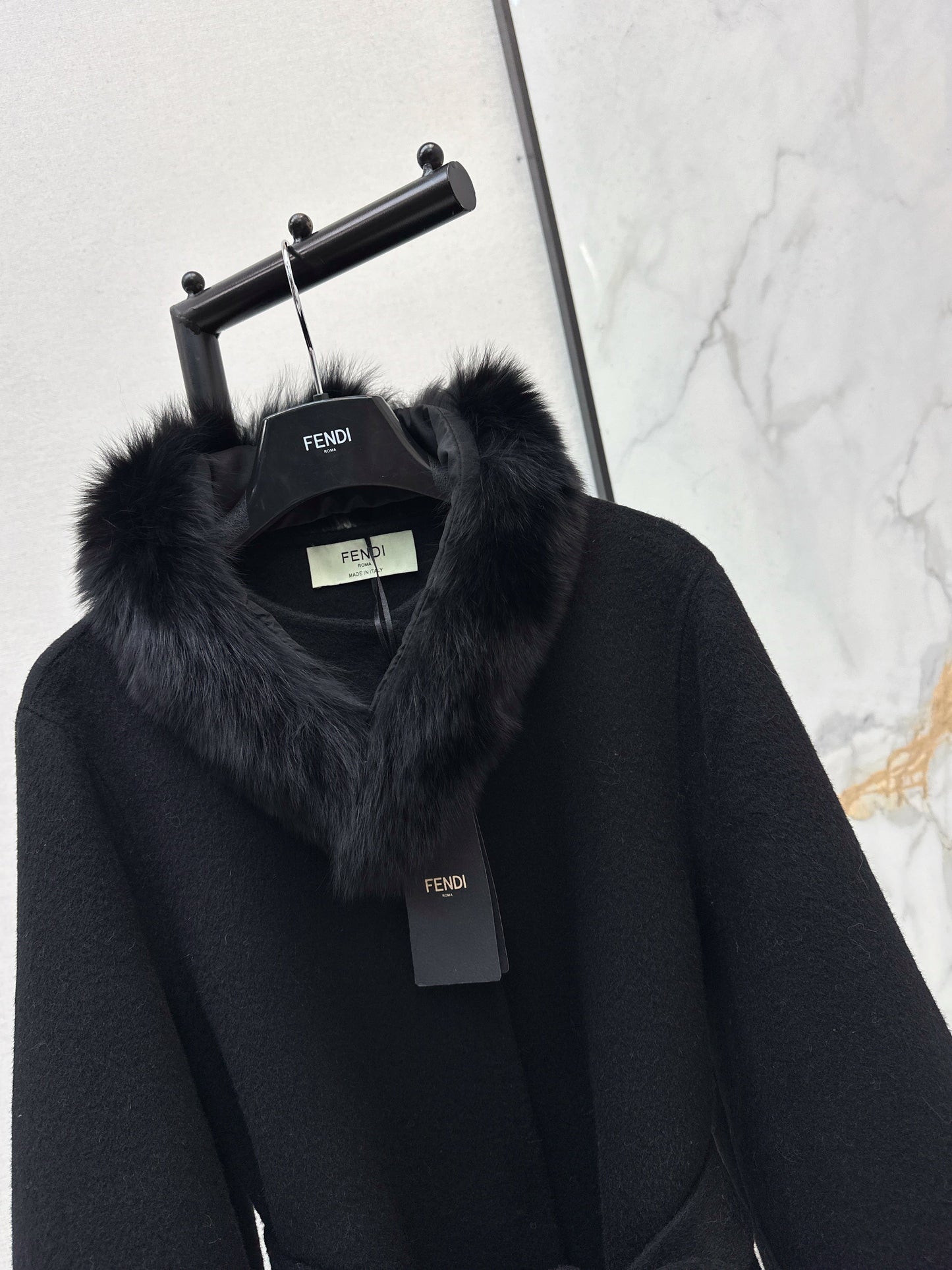 Mid-length coat with fox fur trim