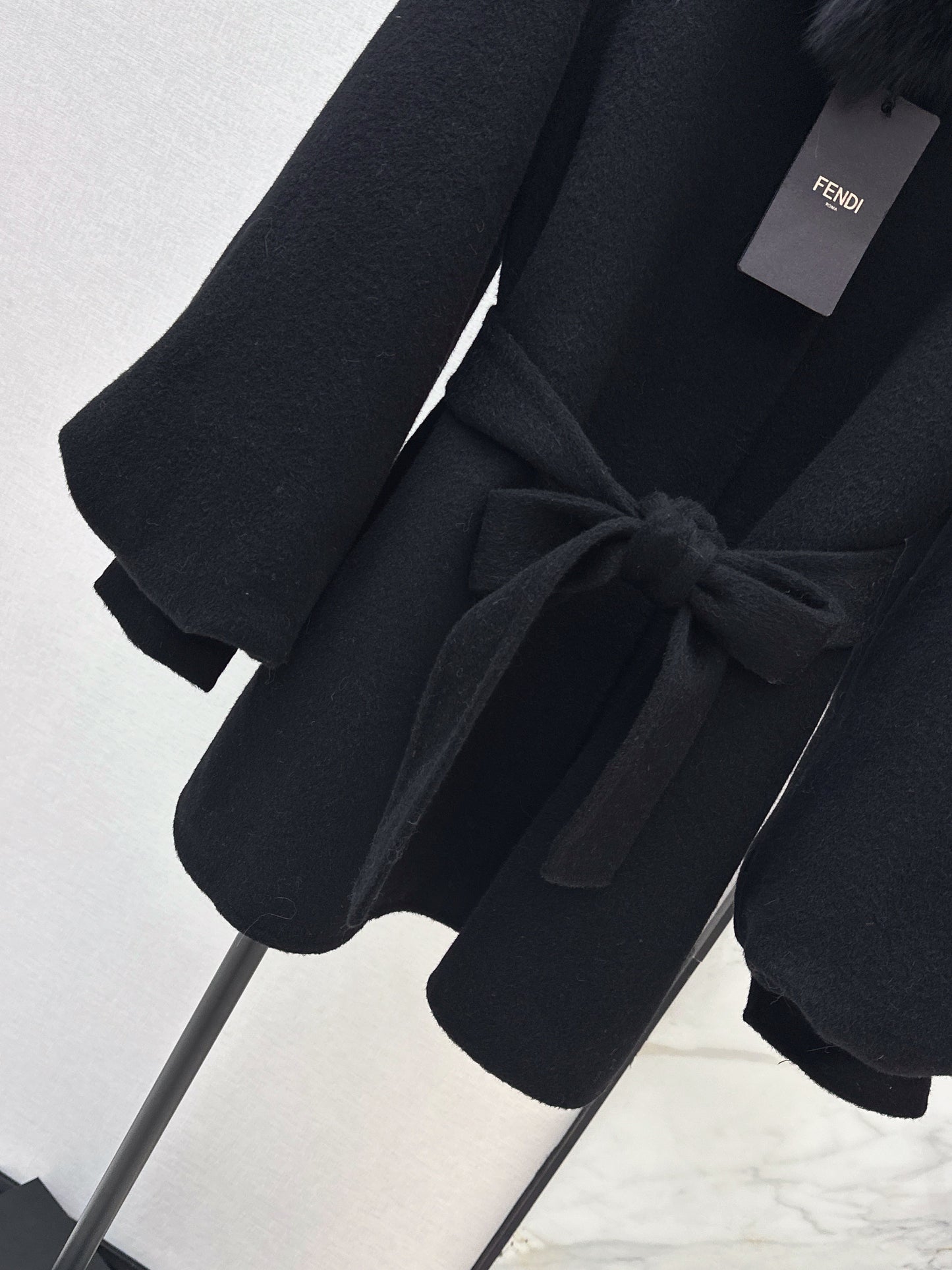 Mid-length coat with fox fur trim
