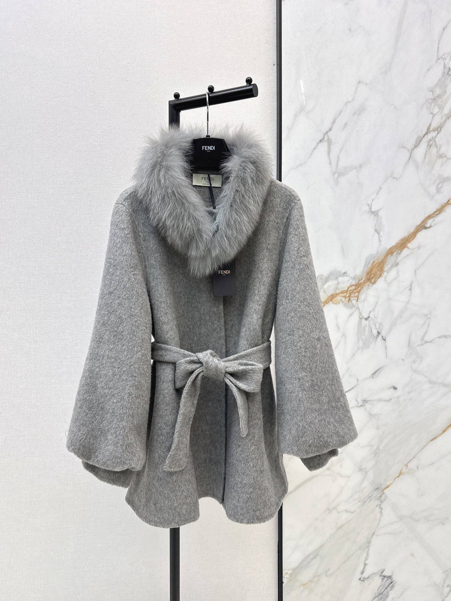 Mid-length coat with fox fur trim