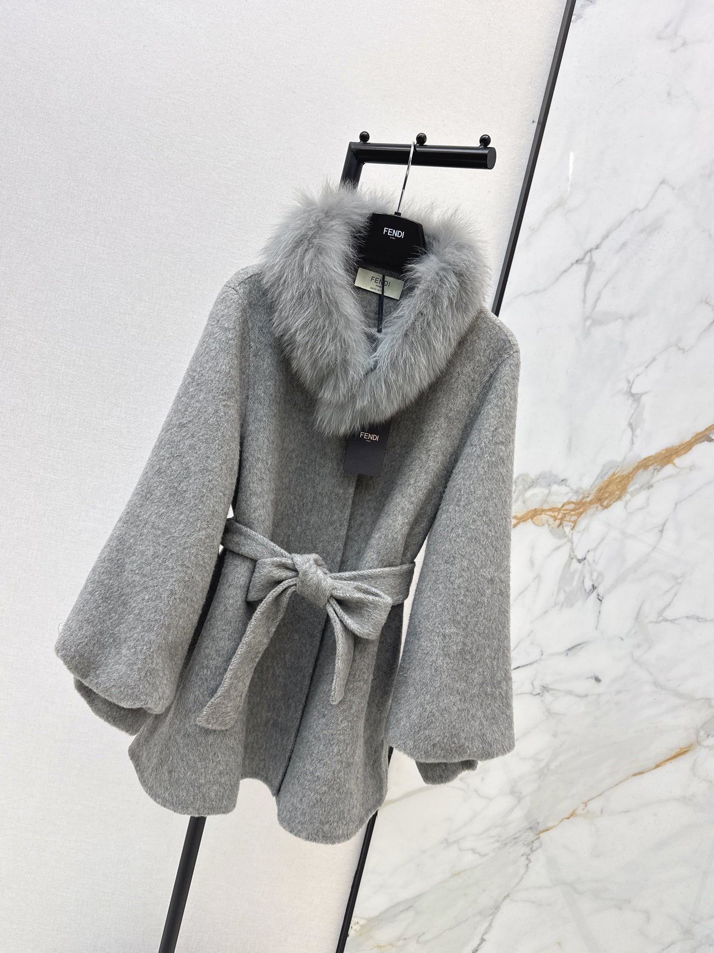 Mid-length coat with fox fur trim