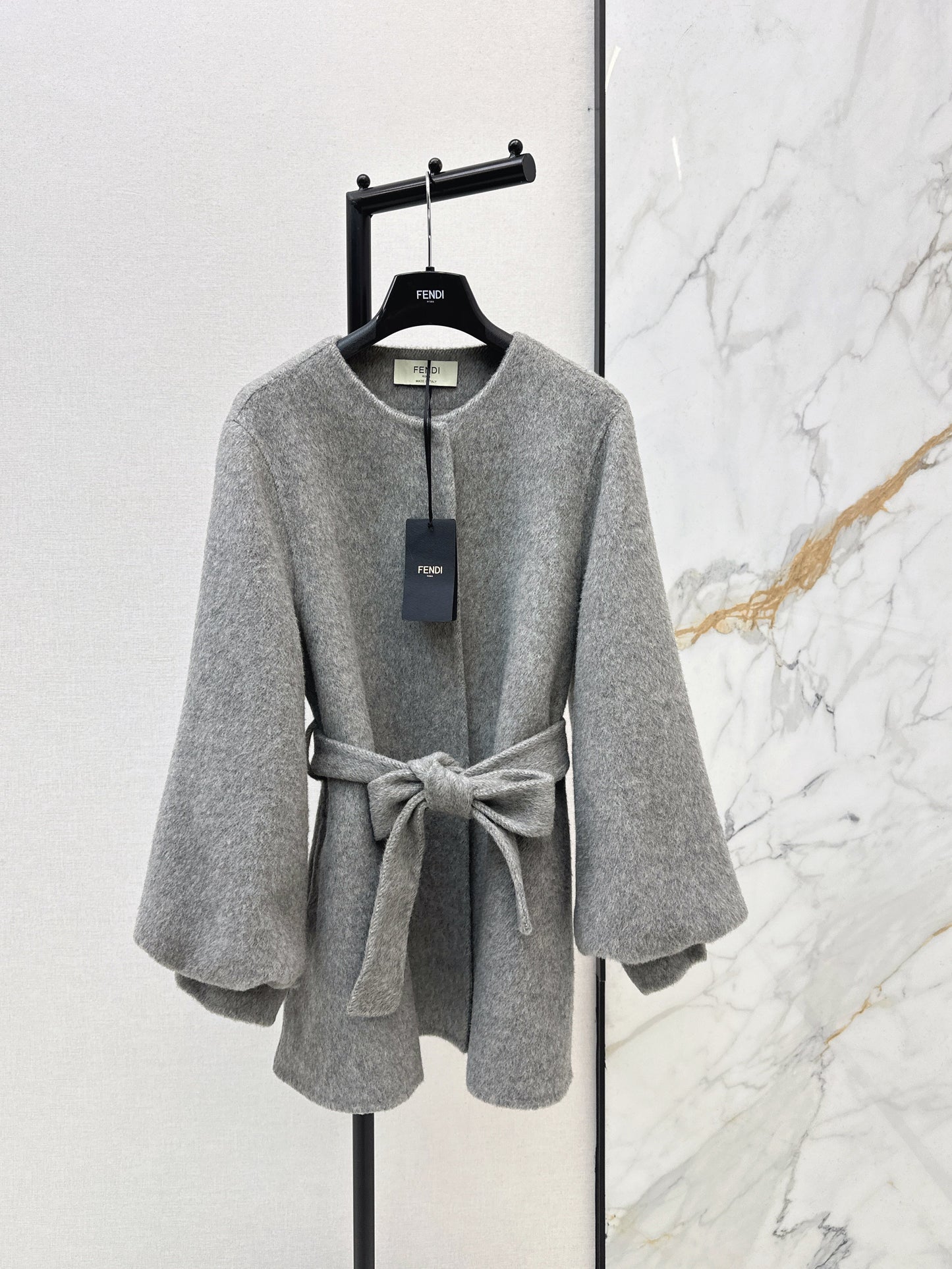 Mid-length coat with fox fur trim
