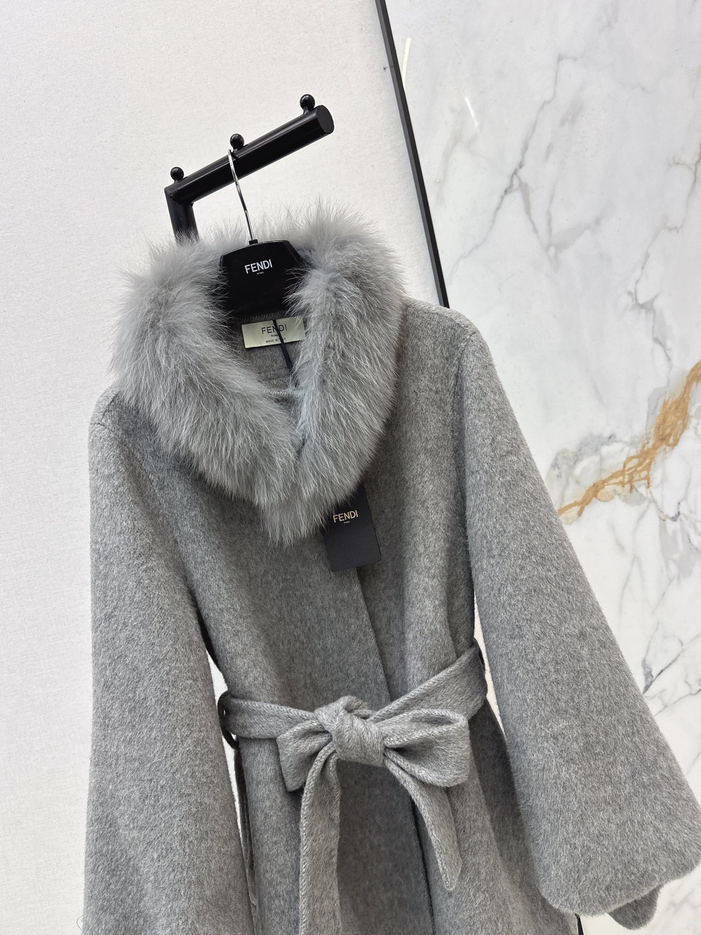 Mid-length coat with fox fur trim
