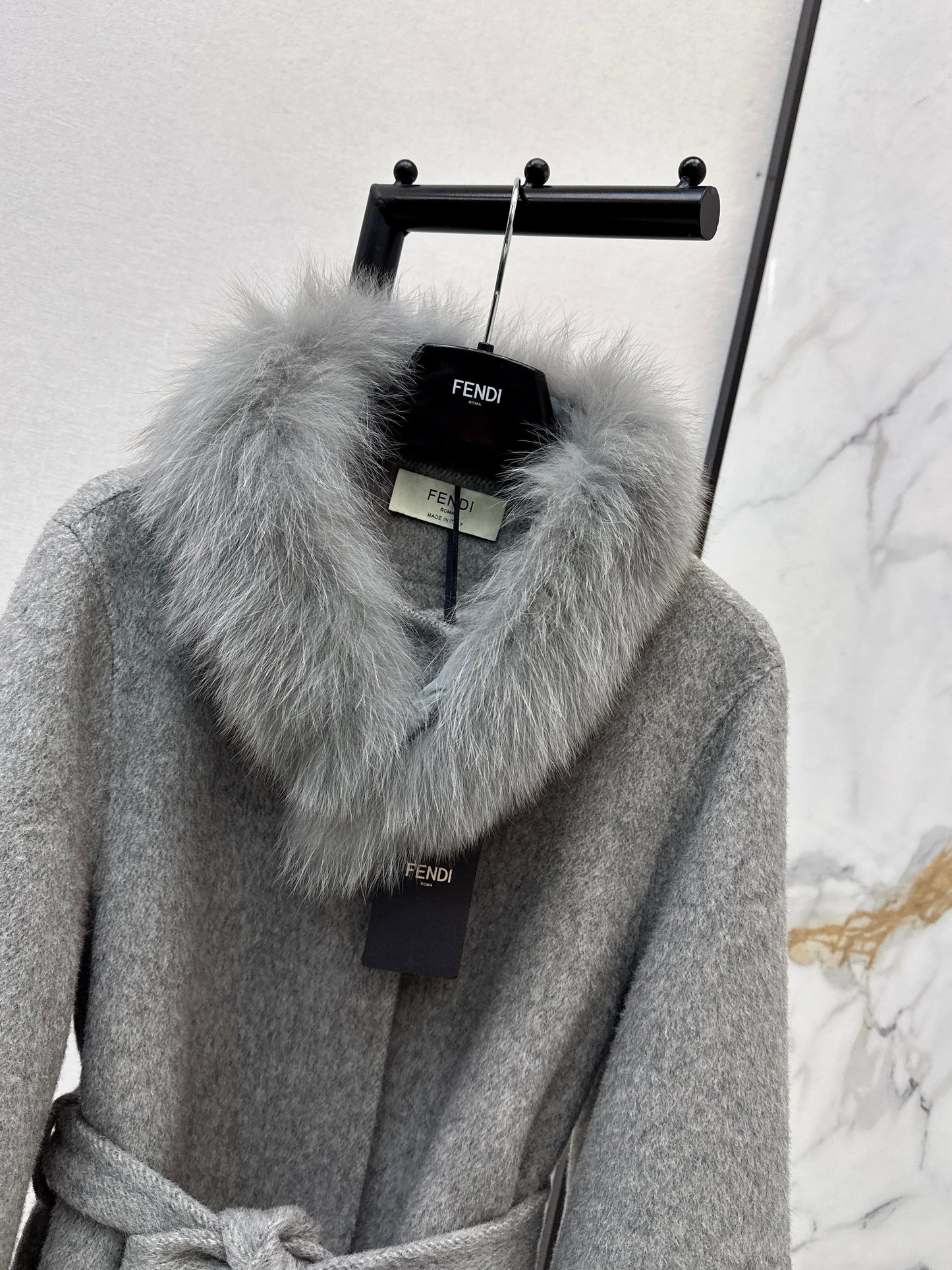Mid-length coat with fox fur trim