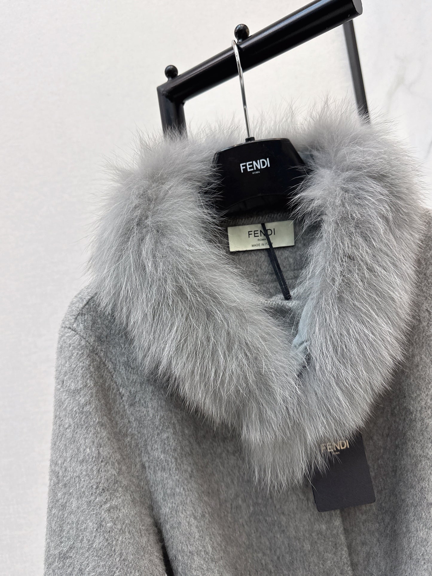 Mid-length coat with fox fur trim