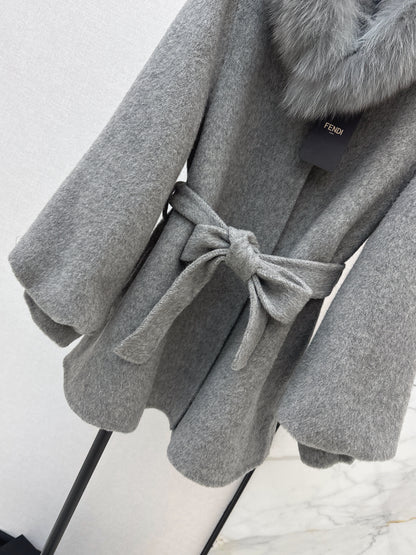 Mid-length coat with fox fur trim