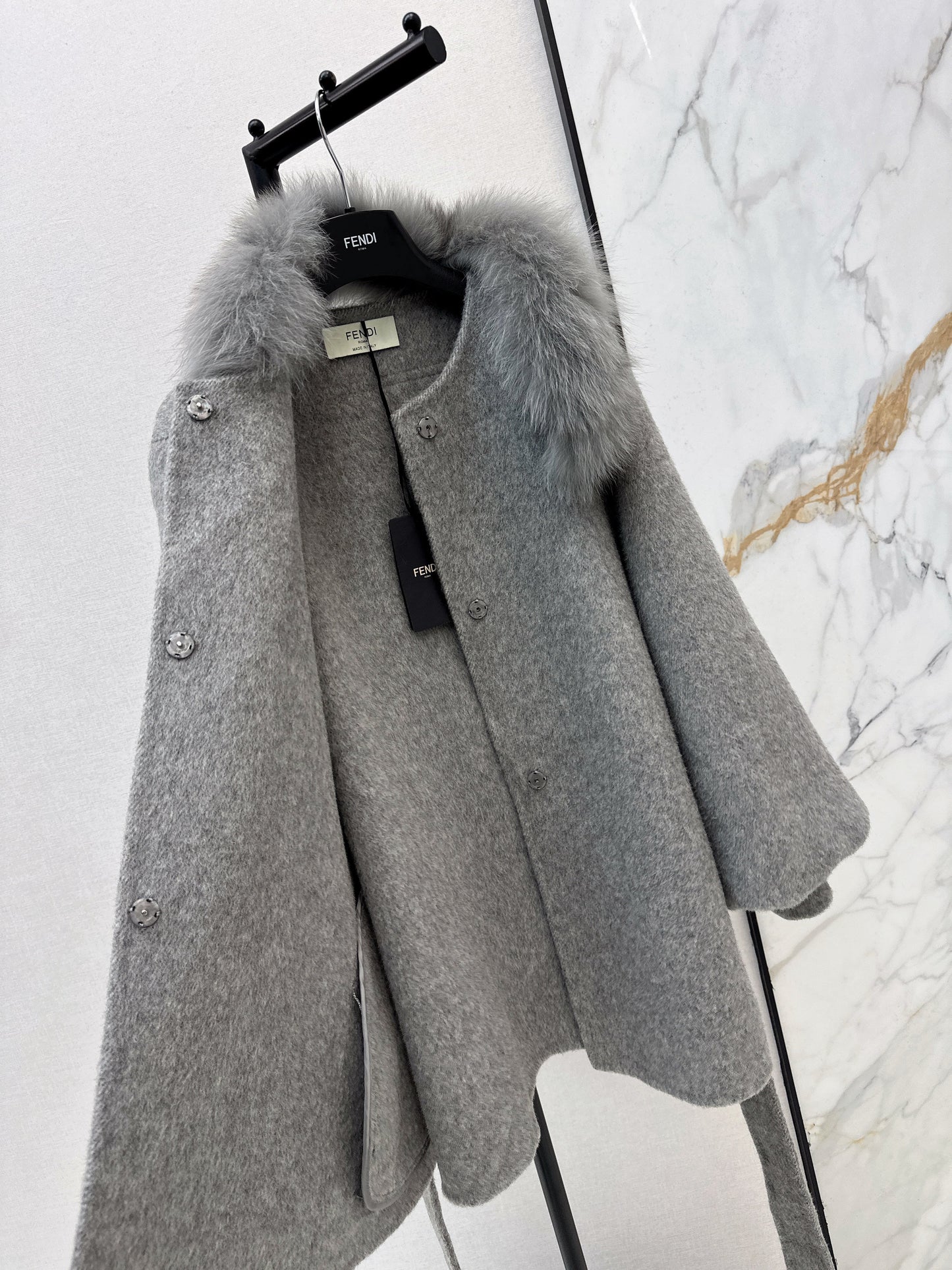 Mid-length coat with fox fur trim