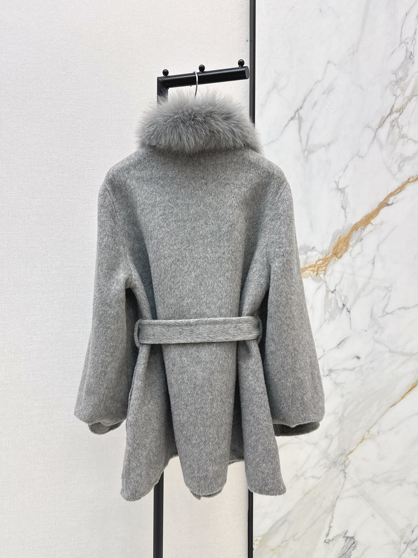 Mid-length coat with fox fur trim