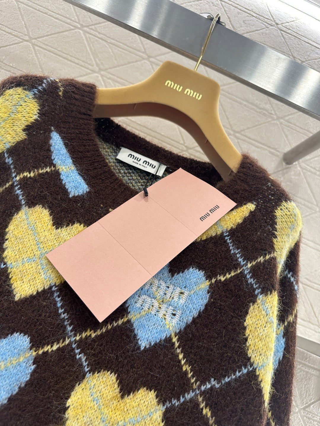 Heart-patterned plaid sweater
