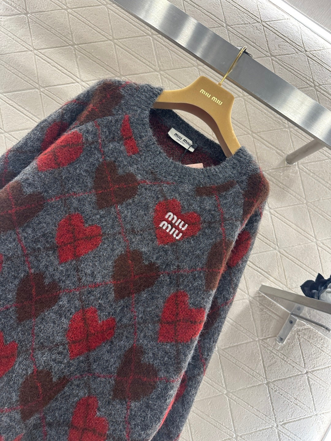 Heart-patterned plaid sweater