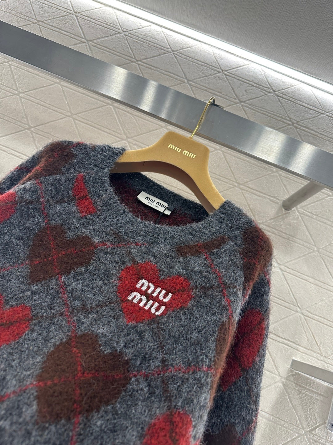Heart-patterned plaid sweater