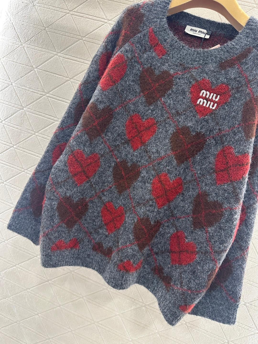 Heart-patterned plaid sweater