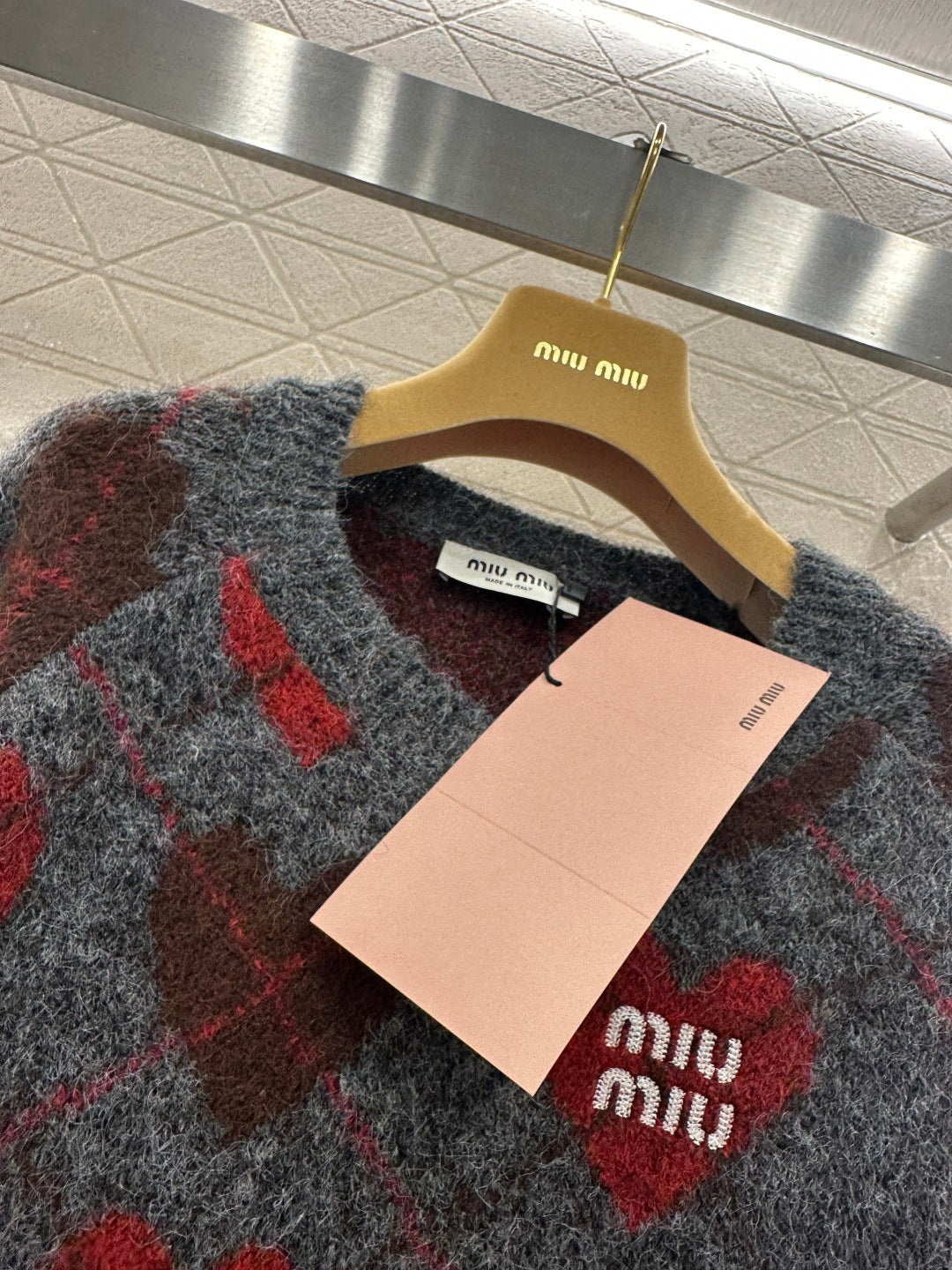 Heart-patterned plaid sweater