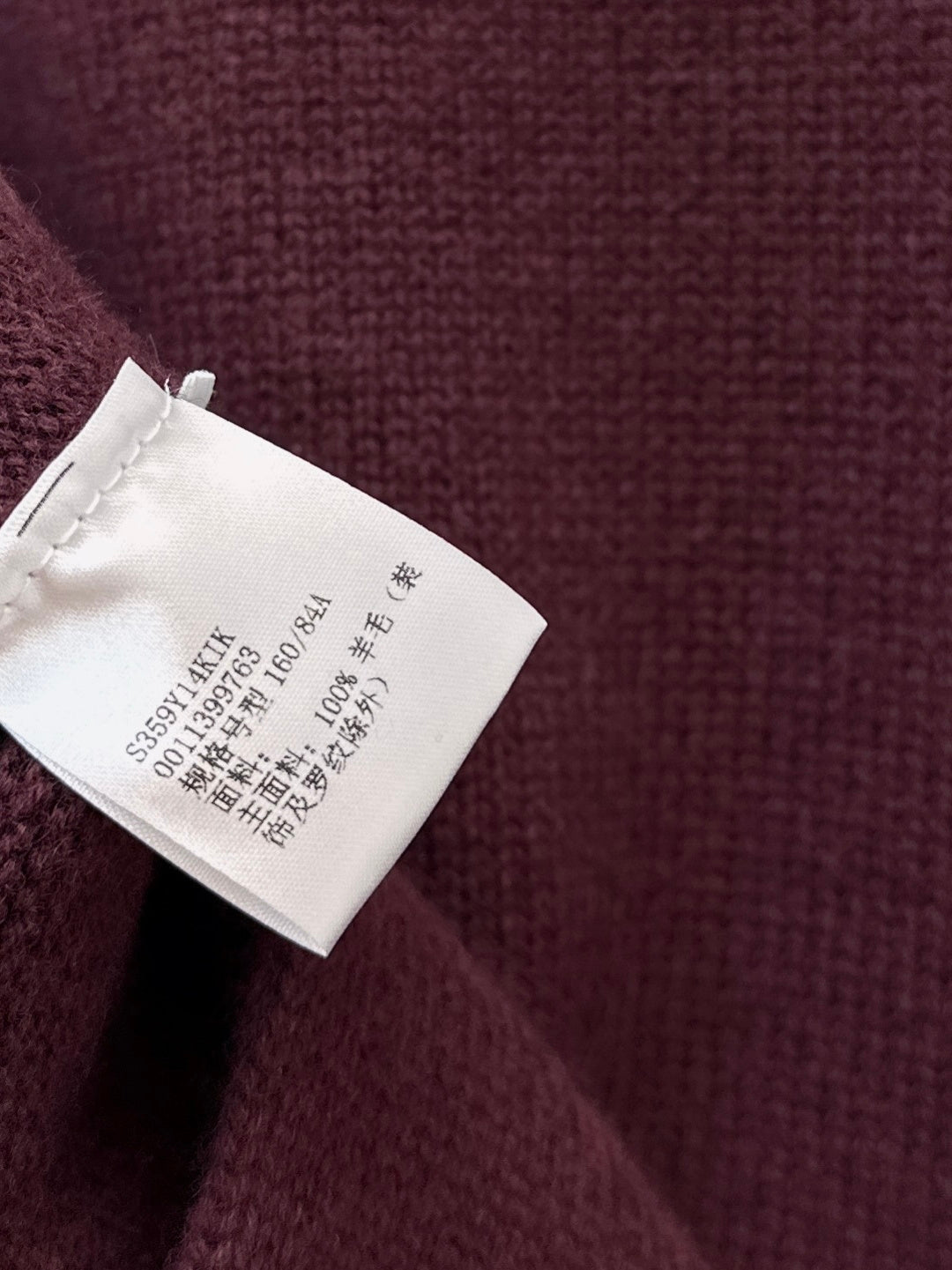 Asymmetrical crew neck sweater