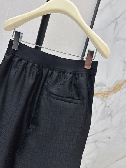 High-waisted elasticated pleated cotton trousers