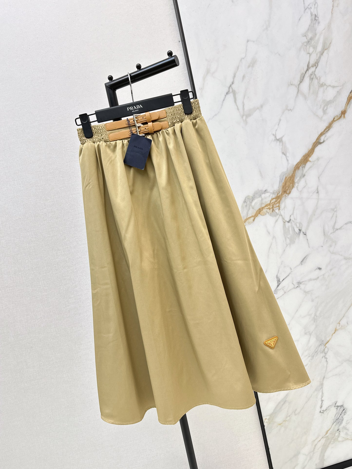 Leather-buckled A-line skirt