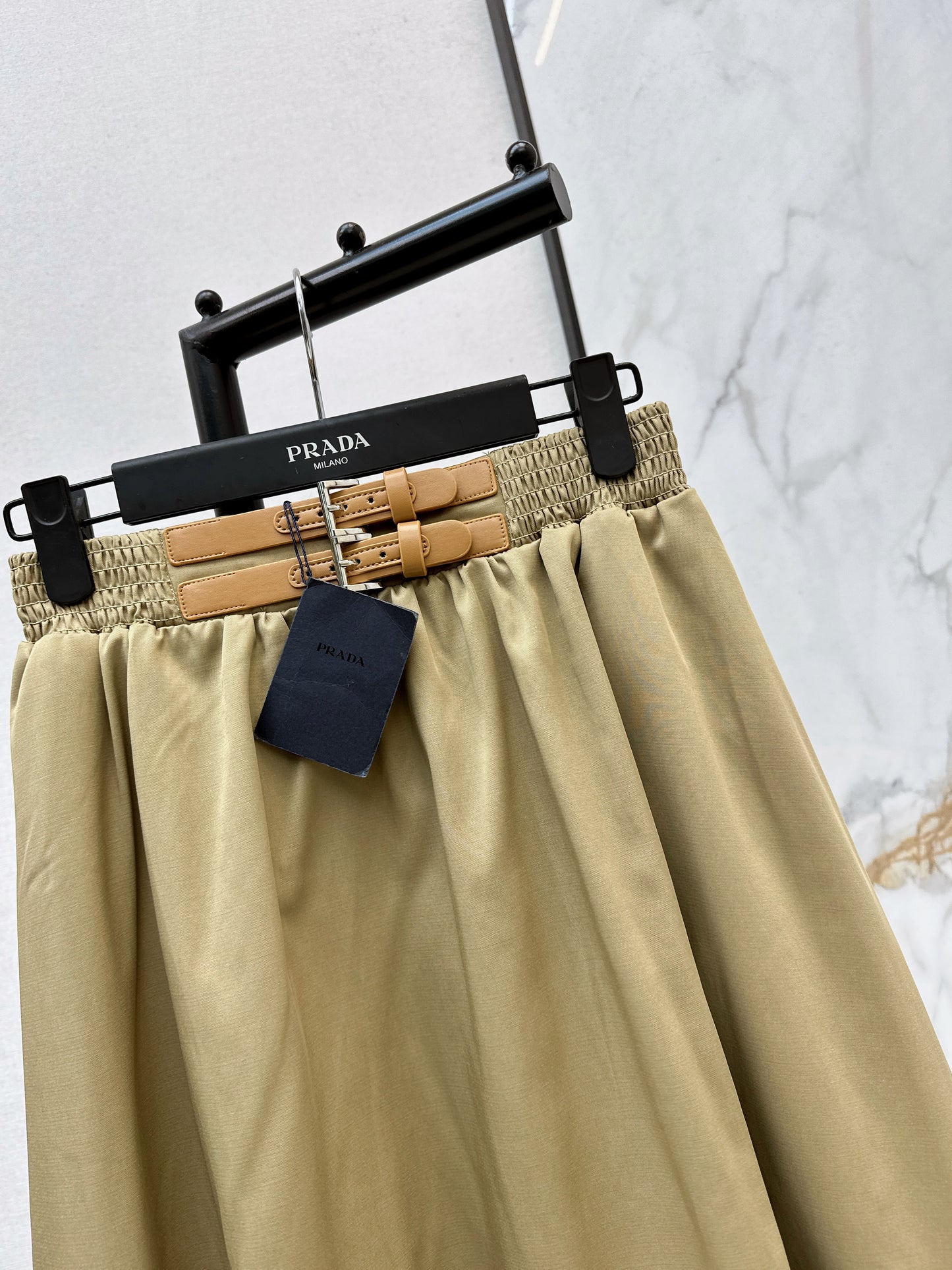Leather-buckled A-line skirt