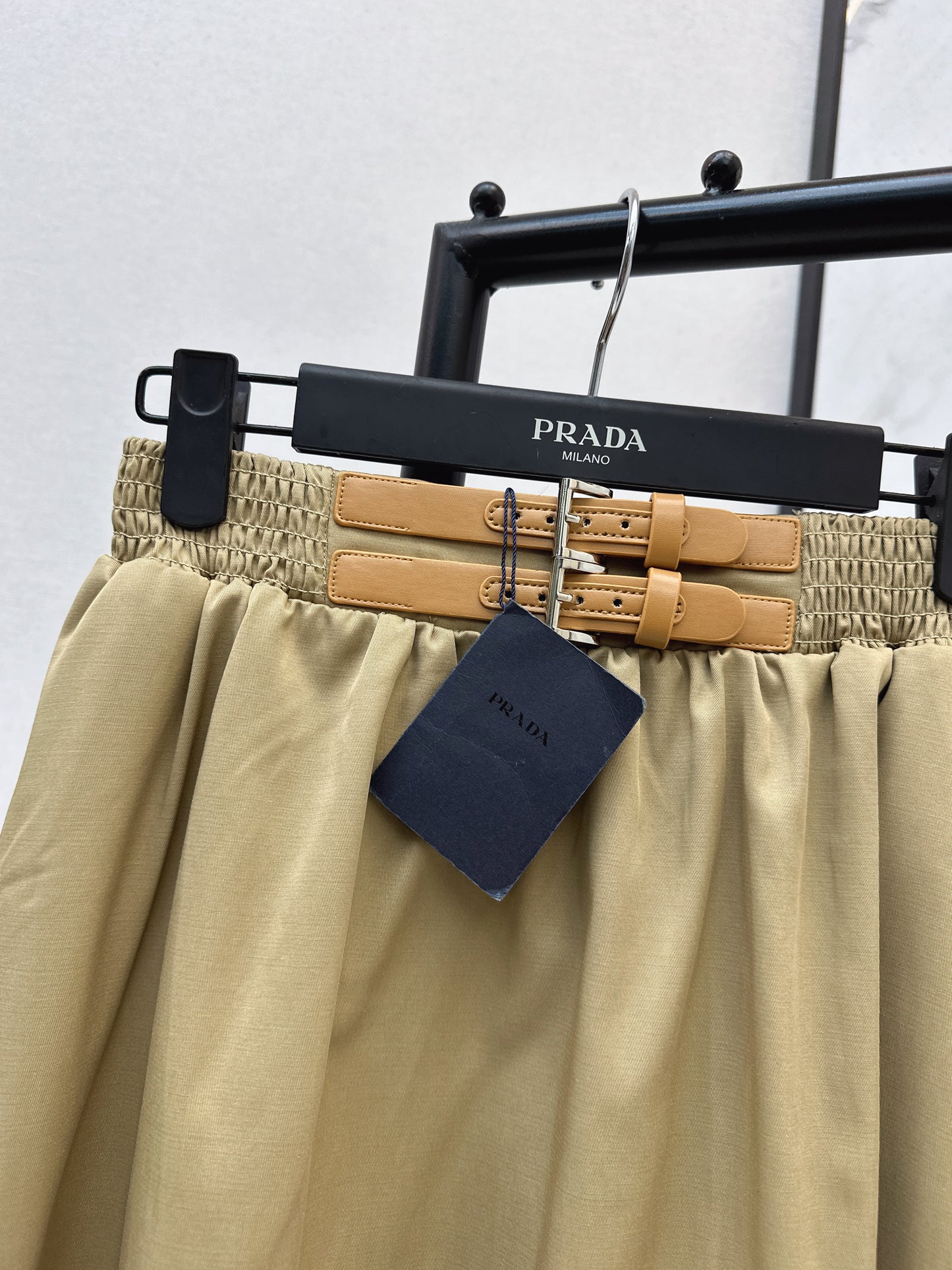 Leather-buckled A-line skirt