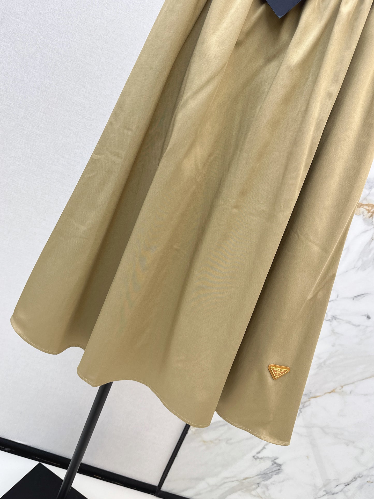 Leather-buckled A-line skirt