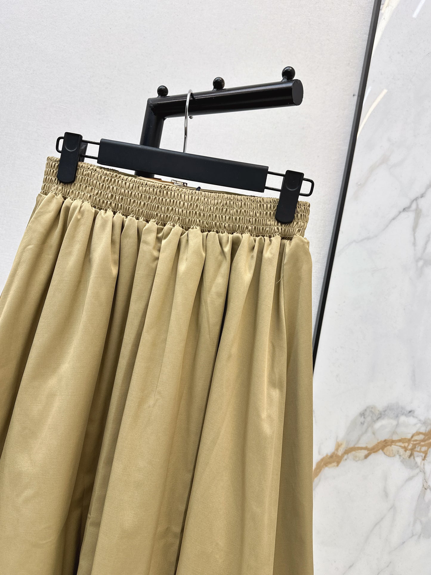 Leather-buckled A-line skirt