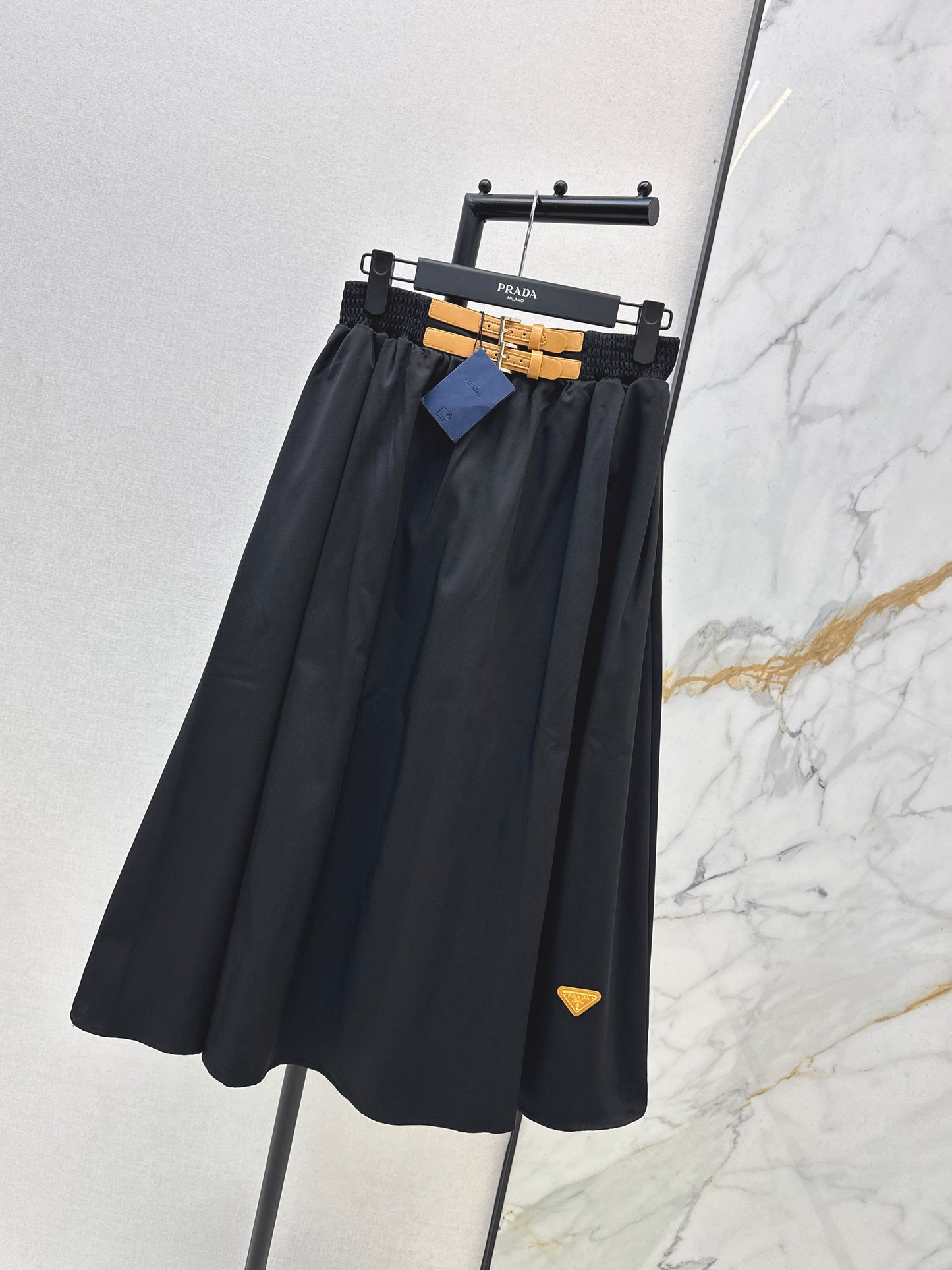 Leather-buckled A-line skirt