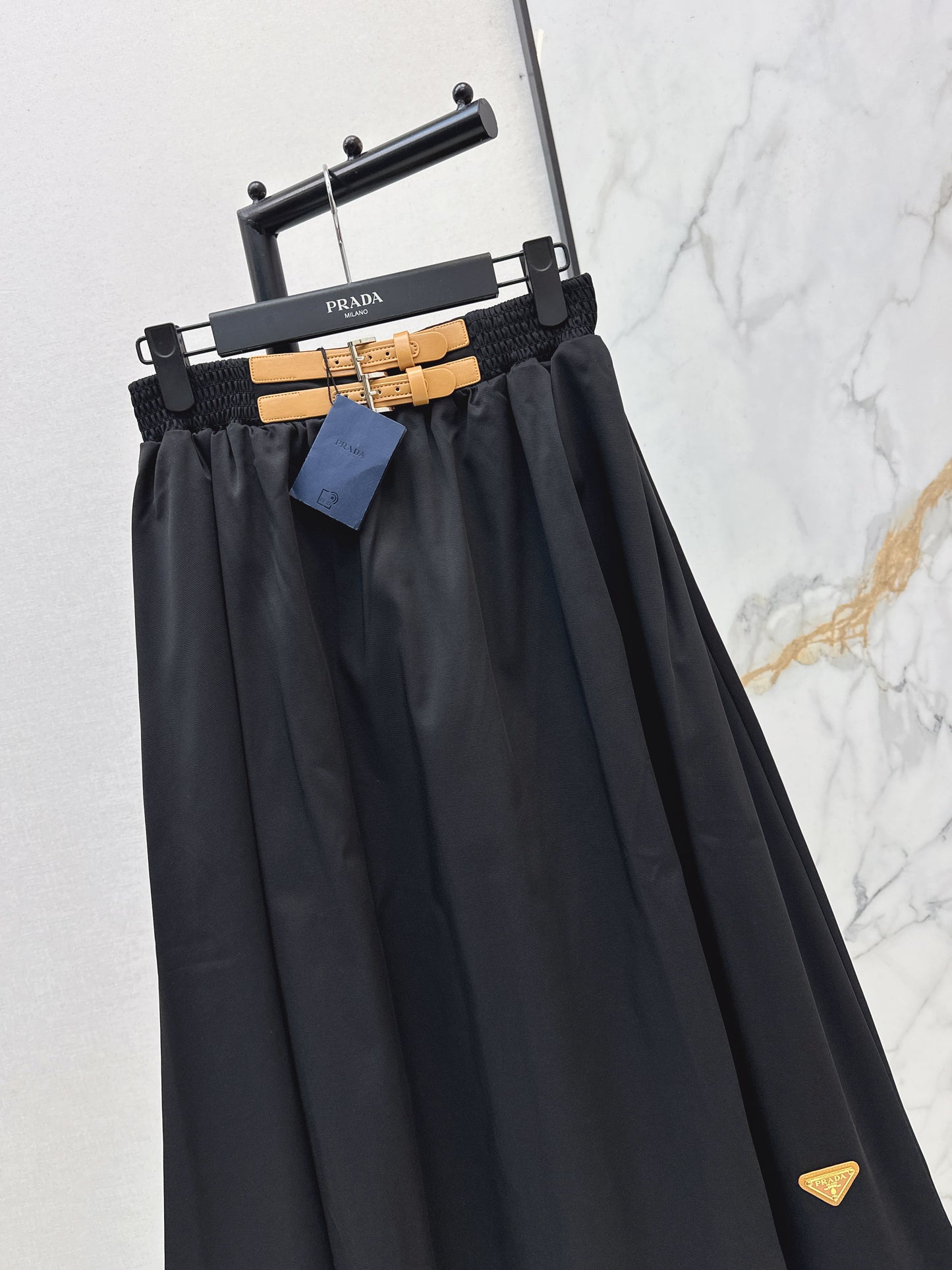 Leather-buckled A-line skirt