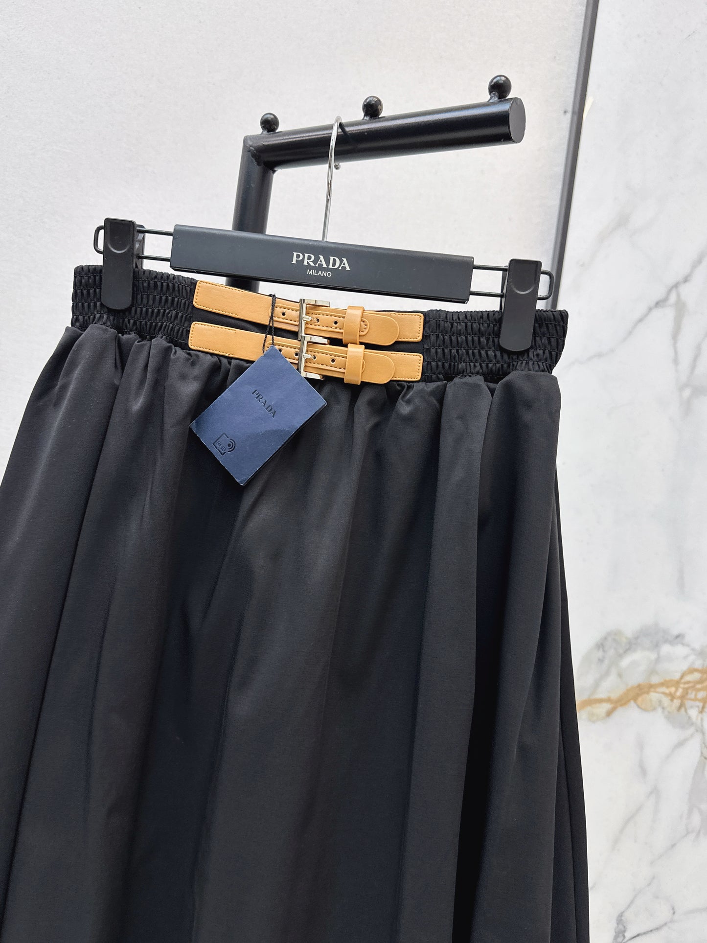 Leather-buckled A-line skirt