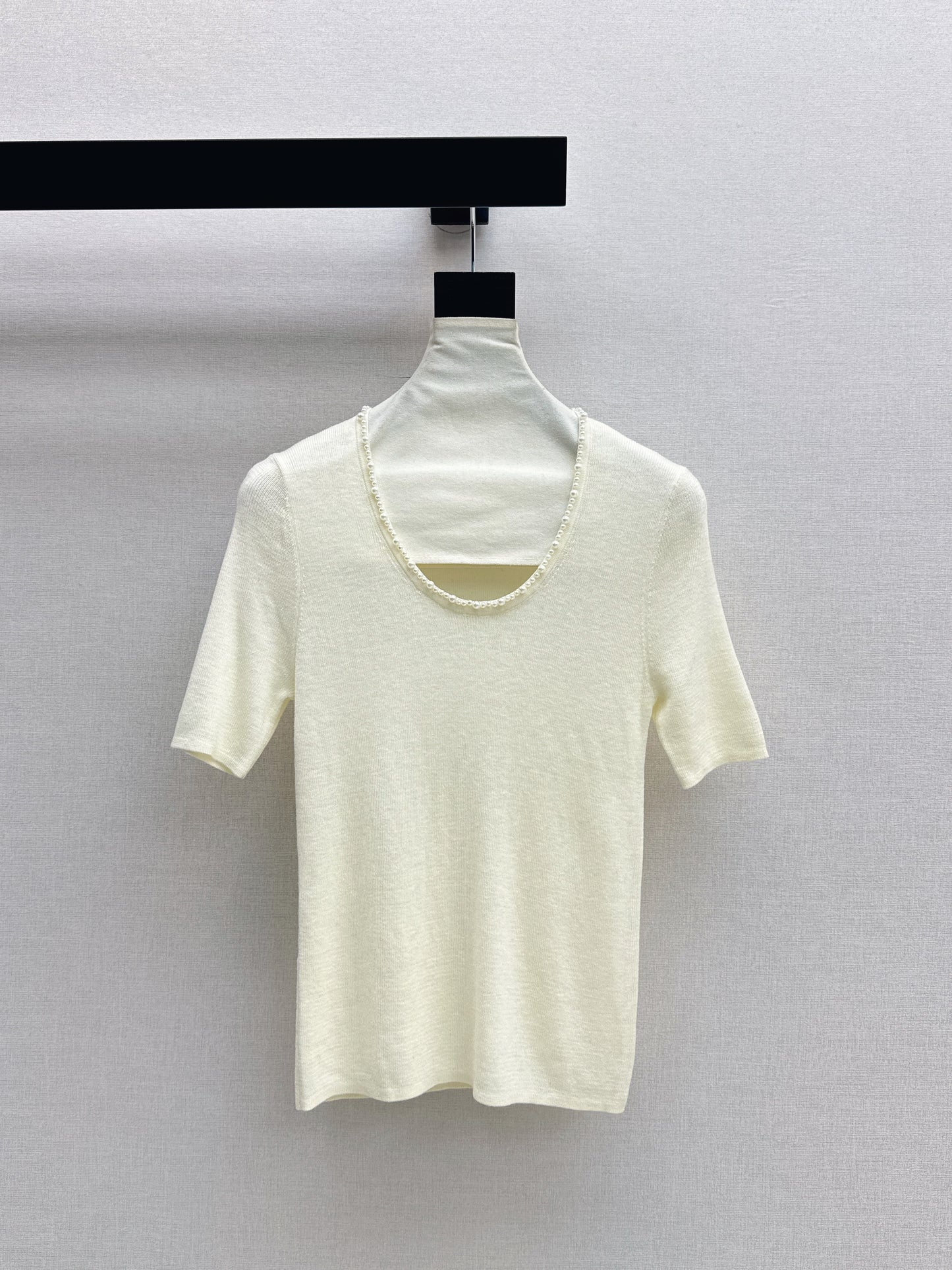 Pearl embellishments on a short-sleeved top