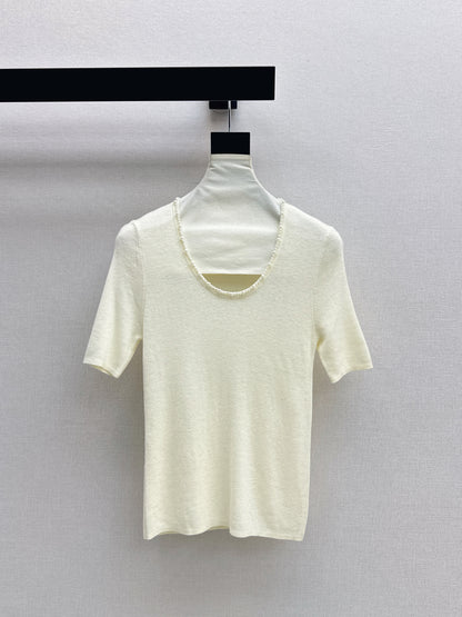 Pearl embellishments on a short-sleeved top