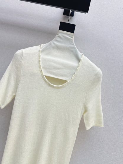 Pearl embellishments on a short-sleeved top