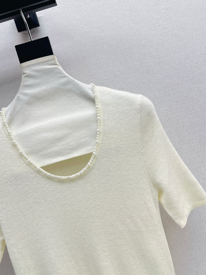 Pearl embellishments on a short-sleeved top