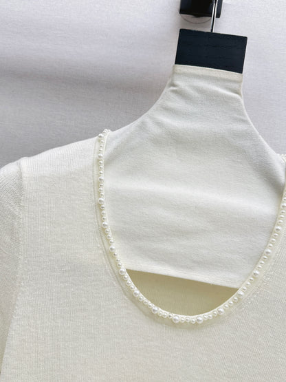 Pearl embellishments on a short-sleeved top