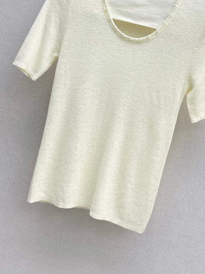 Pearl embellishments on a short-sleeved top