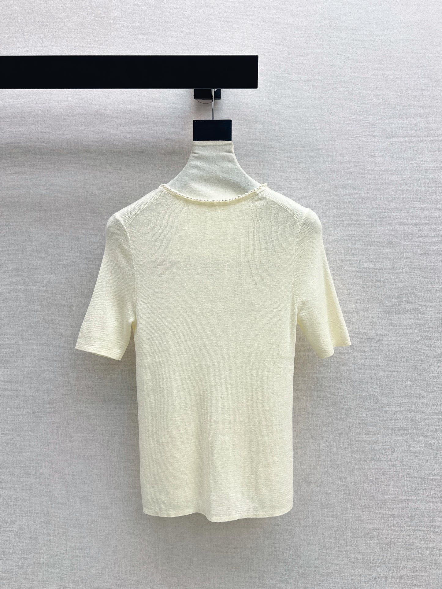 Pearl embellishments on a short-sleeved top