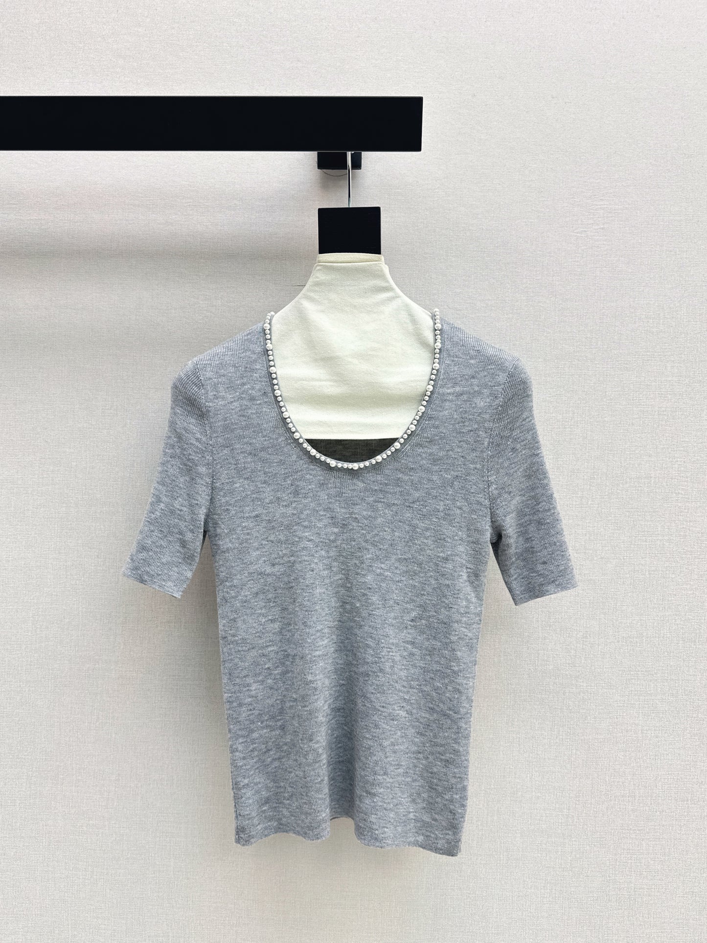 Pearl embellishments on a short-sleeved top